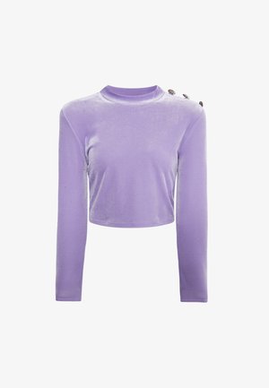 Lilla lühikeste varrukatega topp pehmest sametist. Omab ümmargust kaelust ja kolme dekoratiivset nööpi ühel õlal. Õrn säraefekt.