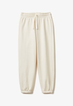 Cremfarbene Jogginghose aus weichem Stoff, mit einem elastischen Bund und Kordelzug sowie elastischen Bündchen an den Knöcheln.