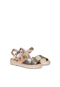 Metallic gold espadrille sandals with crossed straps, featuring a woven jute sole and adjustable ankle straps. Smooth texture and open toe design.