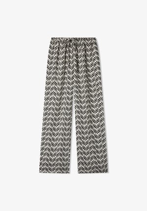 Pantaloni a gamba larga in bianco e nero con una cintura elastica, caratterizzati da un motivo a foglie e da una texture di tessuto liscia.