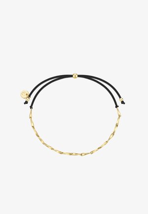 Nastaviteľný náramok z čierneho šnúrového materiálu so zlatými skrútenými článkami spojenými reťazou a malým okrúhlym zlatým príveskom na jednej strane.