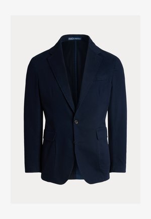 Mørkeblå blazer i bomuldsmateriale, med nedskårne revers, to forlommer og lukning med en enkelt knap, med en glat tekstur.