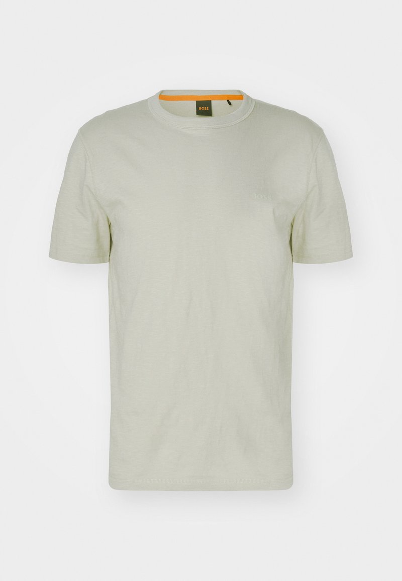 Ljusgrön t-shirt med kort ärm gjord av mjukt material, med rund hals och en subtil logotyp på framsidan. Enkelt design med minimala detaljer.