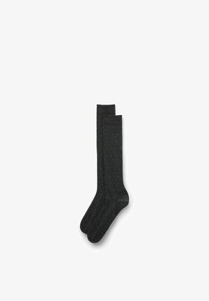 Calcetines hasta la rodilla de color gris oscuro con canalé vertical y pequeños lunares en color verde azulado; confeccionados con un tejido suave para mayor comodidad y elasticidad.