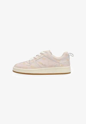 Light beige low-top sneaker with white laces, thick cream sole, and subtle gold accents on smooth leather upper, side pull tab at heel.