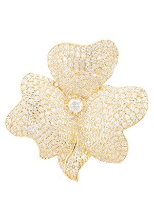 Gold-tone flower brooch featuring a design encrusted with sparkling clear stones, shaped with petals and a central accent. Textured surface details.