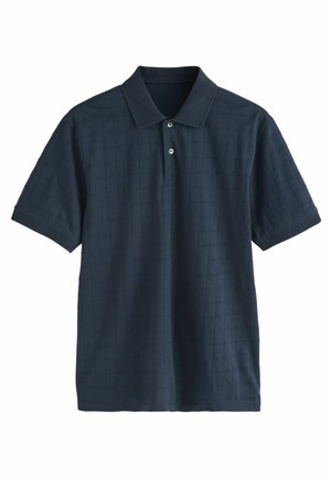 Camisa polo navy de patrón de cuadrícula texturizado, de mangas cortas y con un cuello de tres botones. Tejido ligero con un acabado suave.