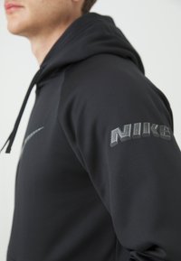Nike Performance HOODIE - Jersey con capucha - black