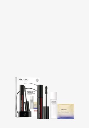 Shiseido makeup set with two black mascaras, a white bottle of makeup remover, and a gold and purple eye mask packet.