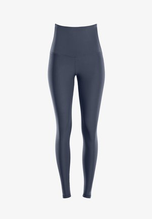 Högmidjade marinblå leggings i ett slätt, elastiskt tyg. Har en sömlös design utan fickor, vilket säkerställer en smickrande siluett.