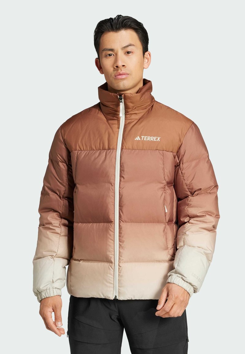 Puffer jacket featuring a gradient color scheme from brown to cream, zip closure, stand-up collar, and elasticized cuffs. Logo on chest.