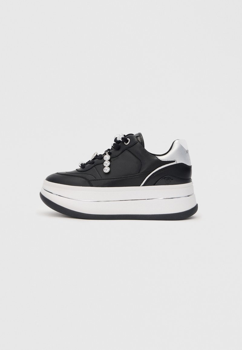 Black platform sneaker featuring leather upper, a silver accent at the heel, white midsole, and decorative metal hardware on the laces.