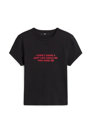 Black cotton t-shirt featuring short sleeves and a crew neckline. Front text in bold red reads, "I DIDN'T KNOW A SOFT LIFE COULD BE THIS HARD."