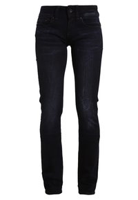 Hubené džíny v tmavě modrém denim s minimálním opotřebením. Mají standardní zapínání na knoflík a zip, design s pěti kapsami a poutka na pásek.