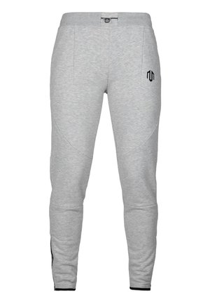 Grå sweatpants med slim fit, der har to sidelommer, en elastisk talje med snøre og et sort logo på venstre lår.