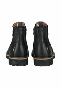 Black leather ankle boots with textured finish, rear zipper closure, and thick rubber sole. Features contrasting tan stitching along seams.