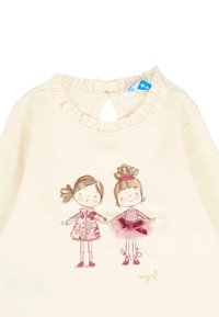 Kremowa koszulka dla niemowląt z falbaniastym kołnierzykiem, z ilustracją dwóch trzymających się za ręce dziewczynek, jedna w różowym płaszczyku, a druga w różowej sukience baletowej.