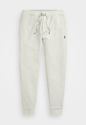 Hellgraue Sweatpants mit elastischem Bund, Kordelzug, seitlichen Taschen, Bündchen an den Knöcheln und kleinem schwarzem Logo am linken Oberschenkel.