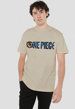 Beige cotton t-shirt featuring a blue and brown graphic text "ONE PIECE" with a skull and crossed swords design at the center.