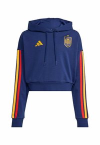 Gekürzter marineblauer Hoodie aus weichem Stoff, mit gelbem Adidas-Logo und Emblem der spanischen Nationalmannschaft. Rote und gelbe vertikale Streifen an den Ärmeln.