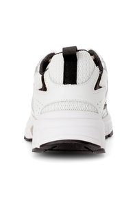 White athletic shoe with a textured mesh upper, contrasting black accents, and a sturdy sole. Features a black pull tab on the heel.