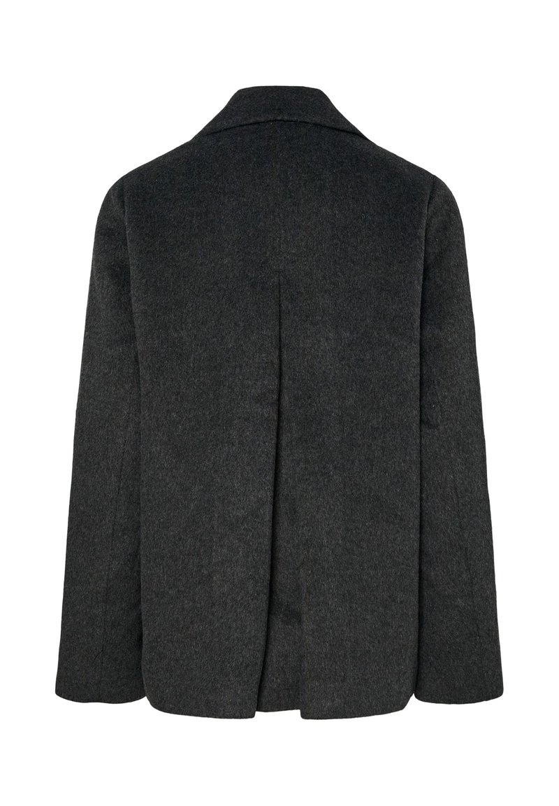 Mörkgrå ullrock med slagkrage, långa ärmar och en ryggslits för ökad rörelsefrihet. Texturerad tyg, minimalistisk design.