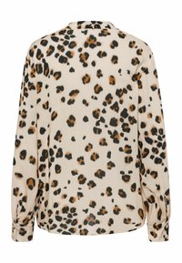 Blouse à manches longues avec un fond beige et un motif léopard marron et noir, dotée de poignets boutonnés et d'un col classique.