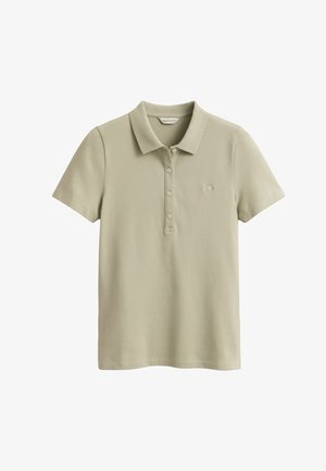 Jasnobeżowa koszulka polo z krótkim rękawem, kołnierzykiem, czterema guzikami oraz małym haftowanym logo na lewej piersi.