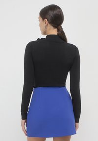 Calliope UNITA  - Gonna a campana - blu