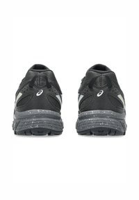 Black athletic shoes with mesh upper, reflective accents, and speckled gray soles. Features padded collar and textured heel for support.