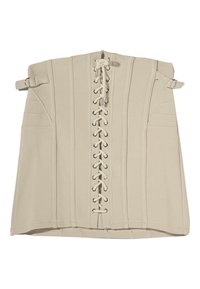 Haut style corset beige avec un design à lacets sur le devant, présentant des accessoires en métal argenté, des coutures verticales et des sangles latérales pour l'ajustement.