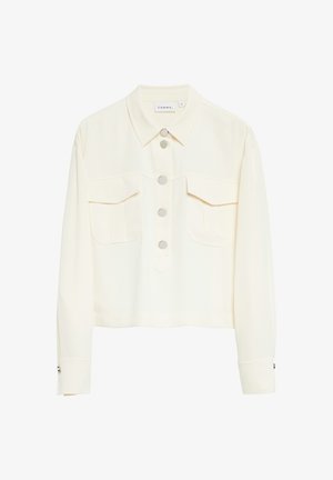 Cremefarbene kurze Jacke mit langen Ärmeln, silbernen runden Knöpfen vorne und zwei Brusttaschen mit Klappen.