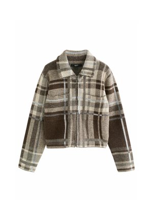Cropped jacket in brown and cream plaid pattern, featuring a collared neckline, front zip closure, and two front pockets. Textured fabric.