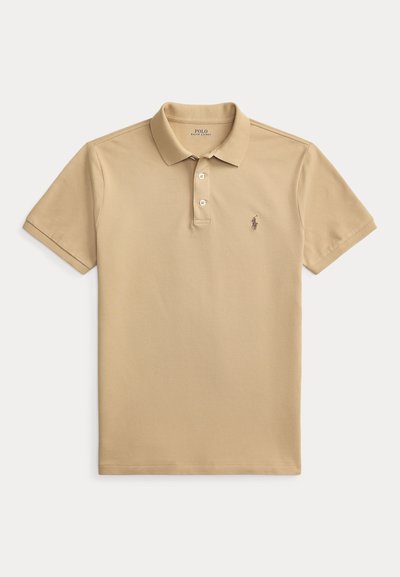 Μπεζ κοντομάνικο πόλο πουκάμισο Polo Ralph Lauren με δύο κουμπιά και κεντημένο λογότυπο αλόγου στο αριστερό στήθος.