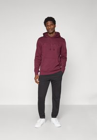 Champion ICONS TONAL CUFF LARGE LOGO - Tracksuit bottoms - black