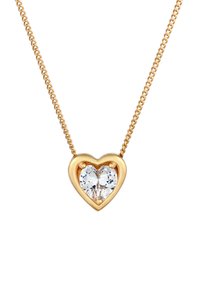 Collana d'oro con un ciondolo a forma di cuore, caratterizzata da una pietra chiara e scintillante incastonata in una montatura d'oro liscia.