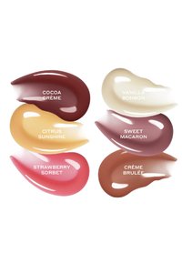 Sechs farbenfrohe Cremeproben mit den Bezeichnungen Cocoa Crème, Citrus Sunshine, Strawberry Sorbet, Vanilla Bonbon, Sweet Macaron und Crème Brulée auf weißem Hintergrund.
