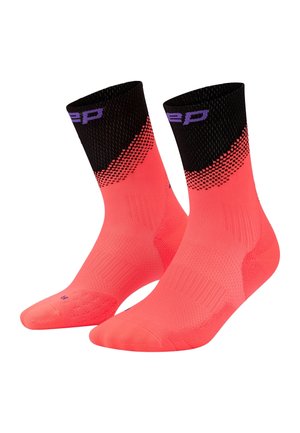 Pair of bright coral ankle socks with black cuffs featuring a purple logo and textured knit patterns for support and breathability.