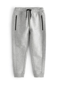 Šedé sportovní joggingové kalhoty vyrobené z měkkého materiálu, s elastickým pasem, šňůrkou a dvěma bočními zipovými kapsami s černými akcenty.