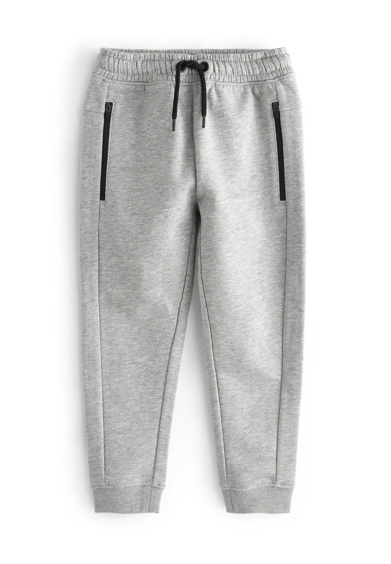 Šedé sportovní joggingové kalhoty vyrobené z měkkého materiálu, s elastickým pasem, šňůrkou a dvěma bočními zipovými kapsami s černými akcenty.