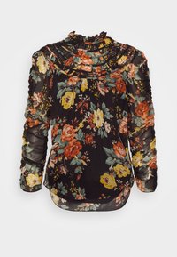 Blouse noire à fleurs avec un col à volants, des manches longues en voile transparent et des motifs floraux vibrants en orange, jaune et vert sur un fond sombre.