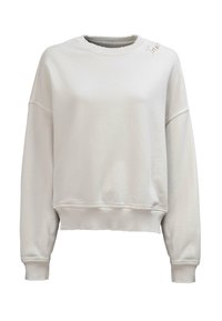 Kremowa bluza z długim rękawem i okrągłym dekoltem, z prążkowanymi mankietami i brzegiem, z haftowanym napisem "True" blisko lewego ramienia.