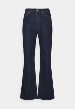 Dark blue denim jeans with a high waist, button and zipper closure, front pockets, and wider flared legs.