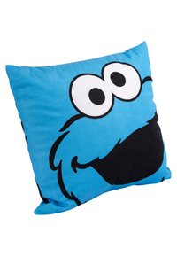 Cuscino blu con un grande volto in stile cartone animato, con occhi sovradimensionati e una bocca nera ampia. Realizzato in tessuto morbido con una superficie liscia.