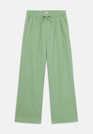 Helle grüne, weit geschnittene Hose aus weichem Stoff, mit einem elastischen Bund und Zugband sowie seitlichen Taschen.