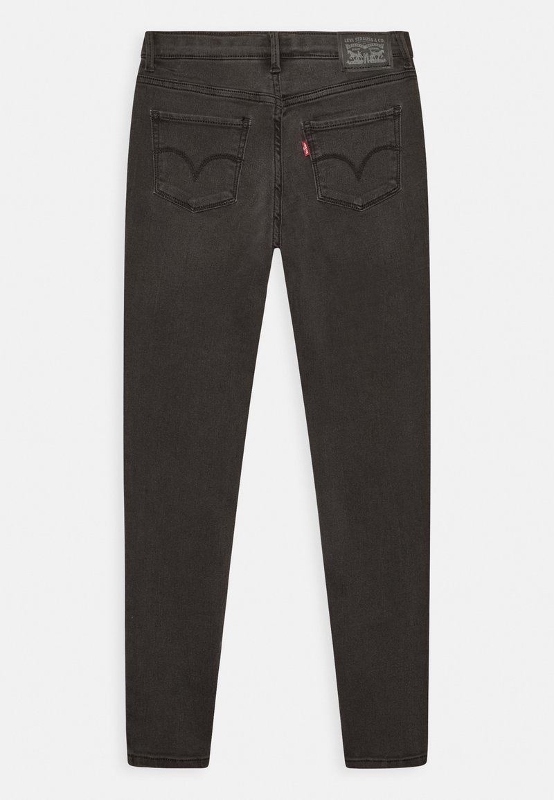 Jeans in denim nero con una vestibilità slim, caratterizzati da due tasche posteriori con una cucitura curva e un'etichetta in pelle sul cinturino.