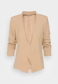 Béžový blazer vyrobený z měkké tkaniny, s hlubokým V-výstřihem, strukturovanými rameny a nařasenými rukávy. Otevřená přední část a minimalistický design.