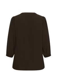 Blouse à manches longues marron foncé avec poignets élastiques froncés et légers plis aux épaules, vue de dos sur fond blanc.