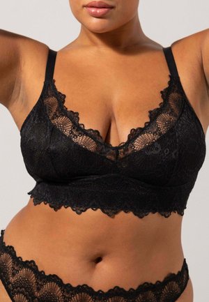Zwarte kanten bralette met geschulpte randen, verstelbare bandjes en een V-halsontwerp. Zachte textuur met ingewikkelde bloemmotieven.