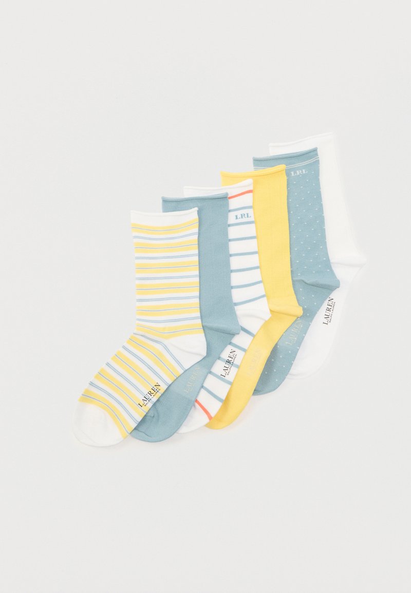 Έξι ζευγάρια κάλτσες μέχρι τη μέση της γάμπας σε κίτρινο, μπλε, λευκό και ριγέ σχέδιο, τοποθετημένα παράλληλα σε λευκό φόντο.